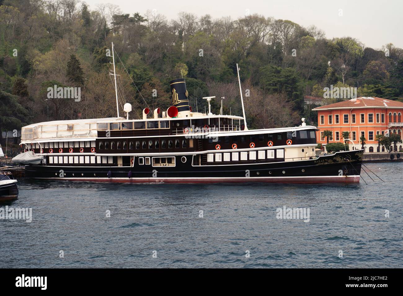 .Historical ship Halas 71 in the Bosphorus anchored ashore. The steamer is available for celebrations and parties. Stock Photo