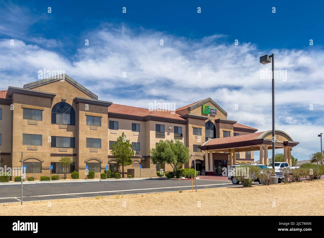 Barstow, CA, USA – June 3, 2022: Holiday Inn and Suites exterior building in the Mojave Desert in Barstow, California. Stock Photo