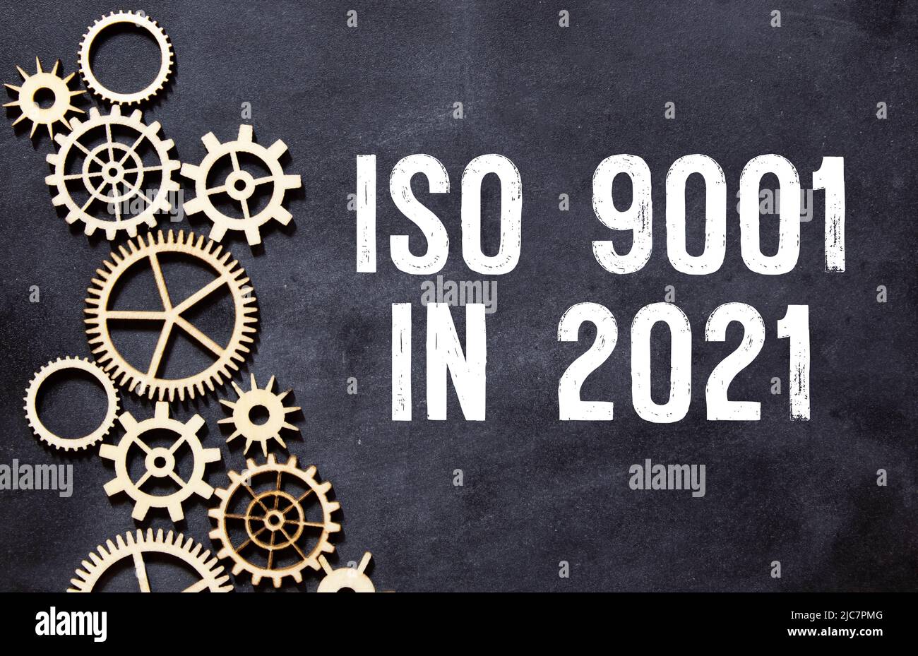 Notepad with text ISO 9001 in 2021. Diagram and white background. Stock Photo