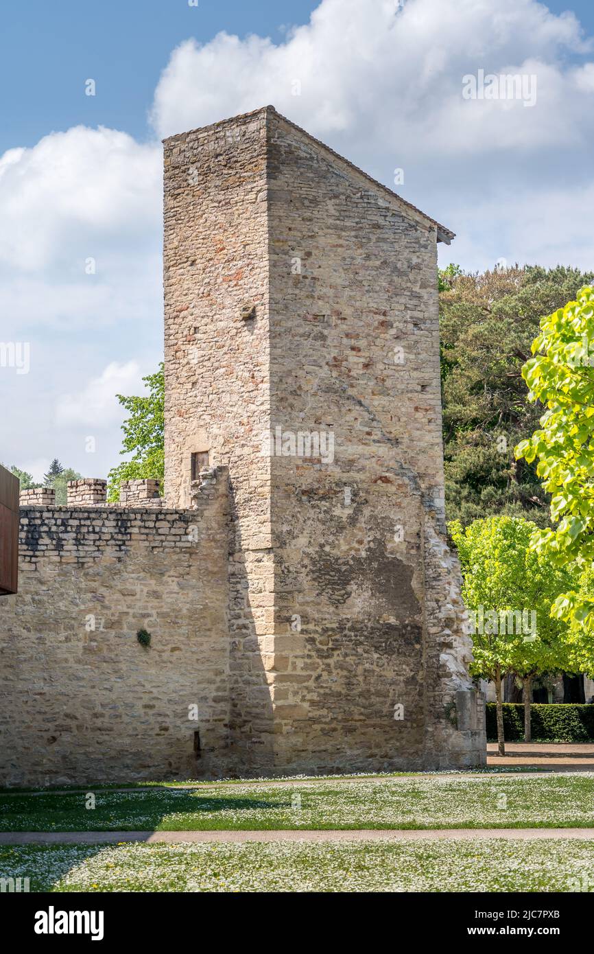 Rectangular defensive tower with loopholes piercing the town walls of