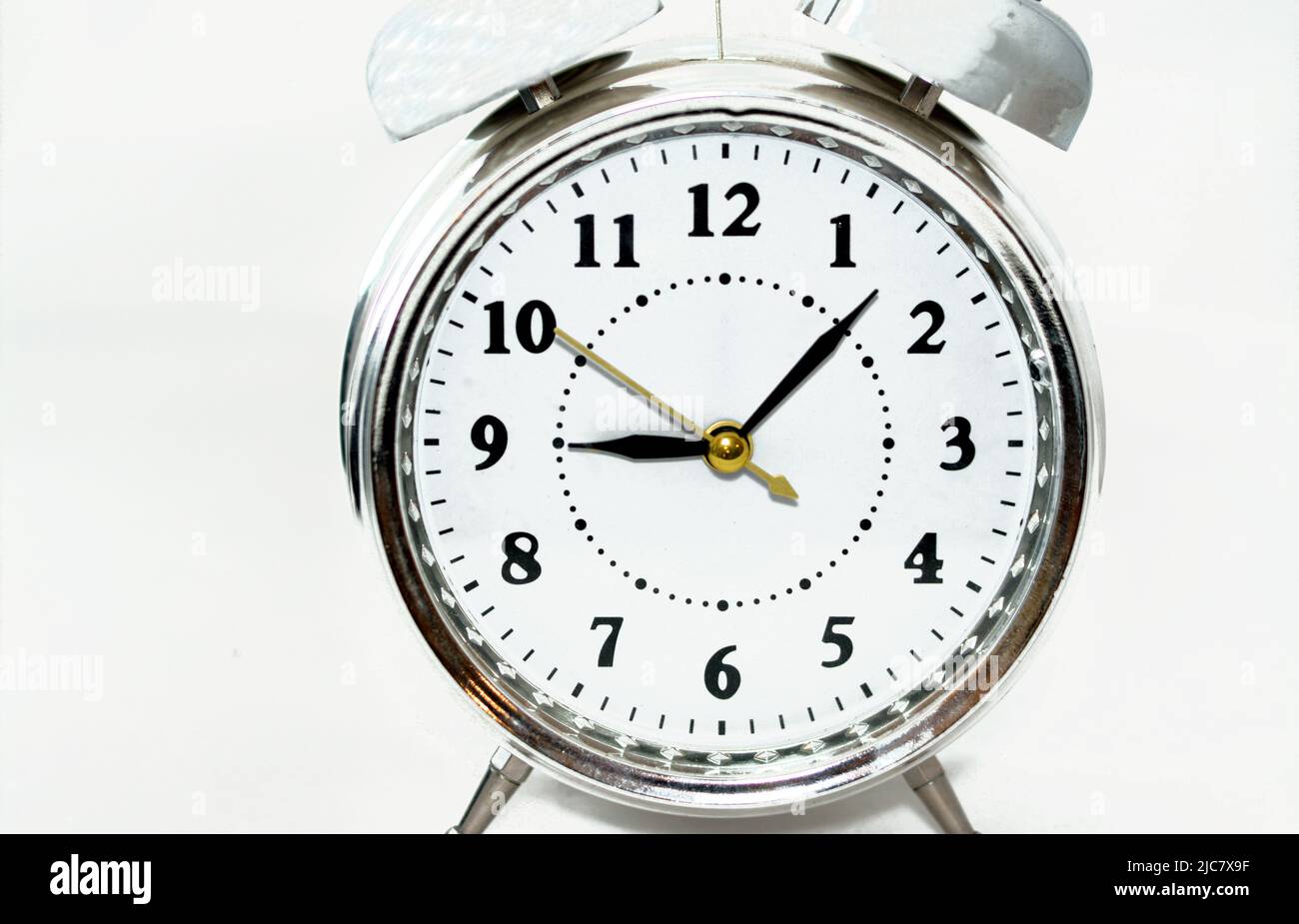 Sliver alarm clock isolated on white background, a vintage retro old