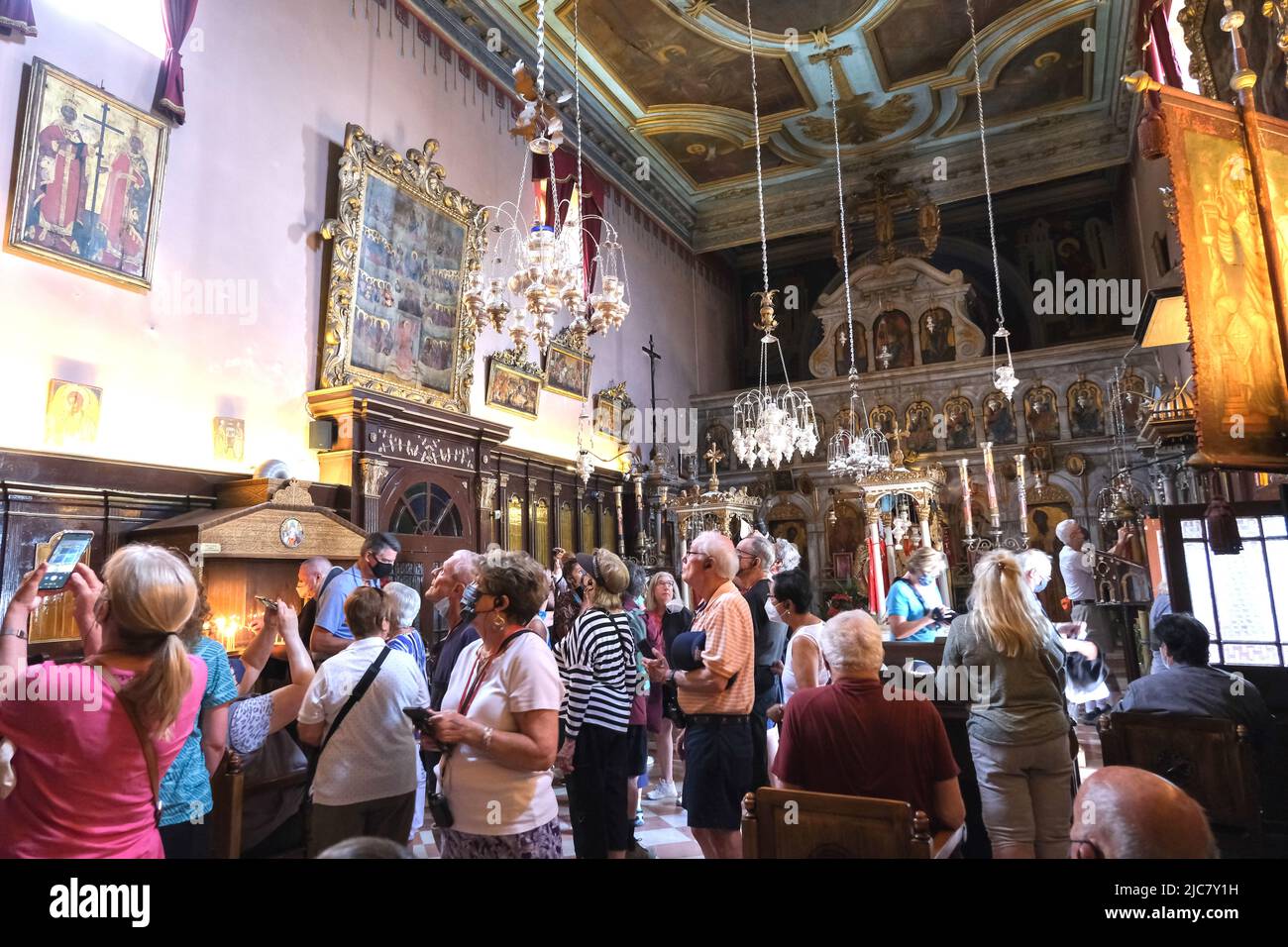 Crowds admire the artwork in Paleokastritsa Monastery on the island of Corfu Greece in May 2022 Stock Photo