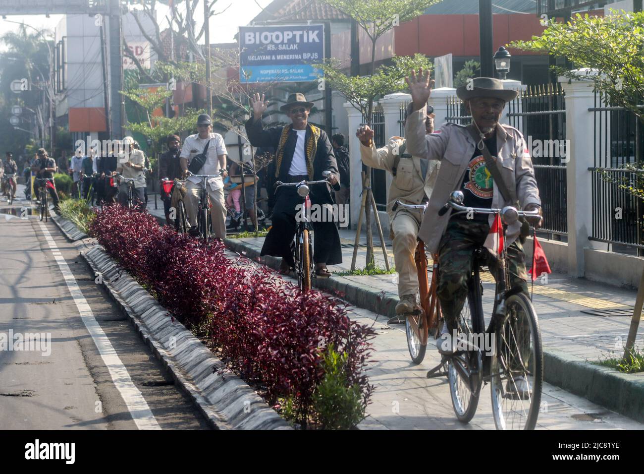 Members of the Onthel community together with the Indonesian Old Bike Community, cycle around the city to celebrate World Bicycle Day Stock Photo