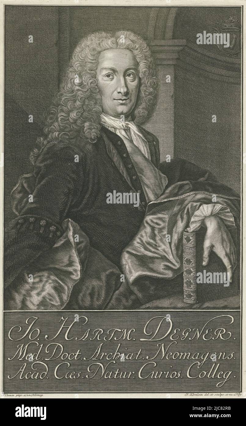 Portrait at half-length to right of Jan Hartmann Degner, physician in Nijmegen. Degner is wearing a wig and has placed his left hand over a book. On the right the family coat of arms and in the margin a three-line text, Portrait of Jan Hartmann Degner, print maker: Johannes Körnlein, (mentioned on object), Theodorus Caenen, (mentioned on object), Amsterdam, 1741, paper, engraving, h 295 mm × w 190 mm Stock Photo