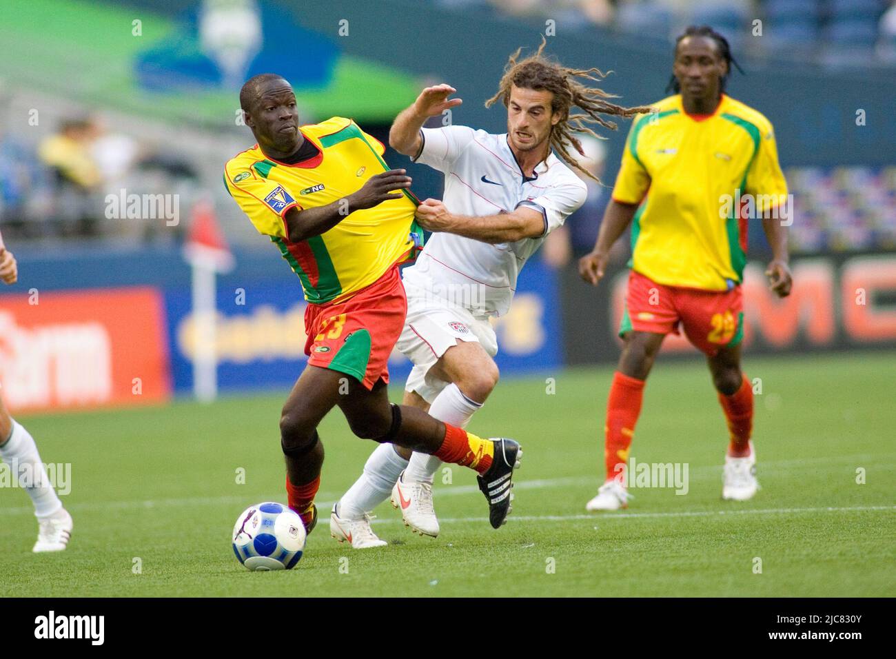 Seattle, Washington, USA. 04th July, 2009. 04 July 2009: Patrick Modeste (23) trying to escape the grasp of Kyle Beckerman (5). Gold Cup 2009, Grenada vs. United States at Qwest Field in Seattle, WA. (Credit Image: © Andrew Fredrickson/Southcreek Global/ZUMApress.com) Stock Photo