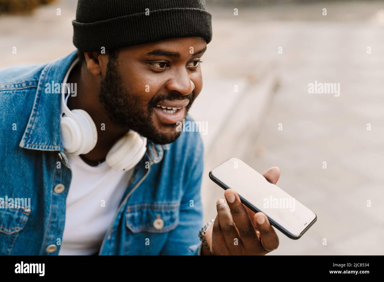 Man talking phone headphone hi res stock photography and images