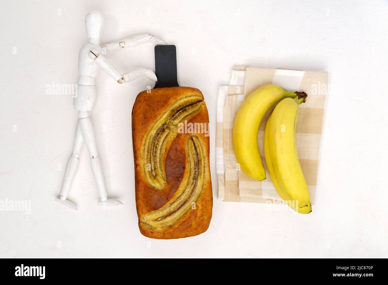 Baked banana bread, sliced on a cutting board. Bakery, cafe, home chef