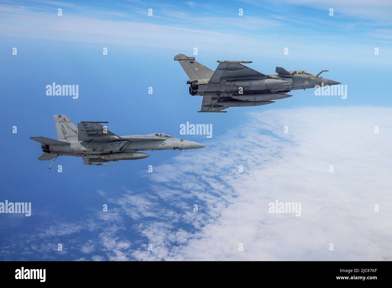 Mediterranean Sea. 19th May, 2022. A French Rafale F-3R flies alongside an F/A-18E Super Hornet, attached to the Fighting Checkmates of Strike Fighter Squadron (VFA) 211, in support of Neptune Shield 22, May 19, 2022. Neptune Shield 22 is the natural evolution of NATO's ability to integrate the high-end maritime warfare capabilities of an Aircraft Carrier Strike Group, an Amphibious Ready Group and a Marine Expeditionary Unit to support the defense of the alliance. Credit: U.S. Air Force/ZUMA Press Wire Service/ZUMAPRESS.com/Alamy Live News Stock Photo