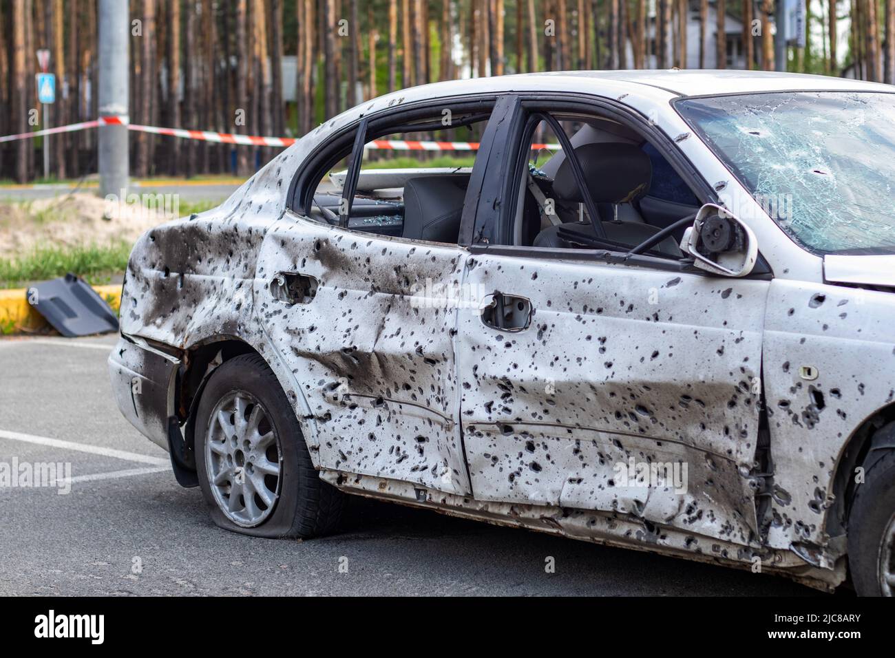 Shot, damaged cars during the war in Ukraine. The vehicle of civilians