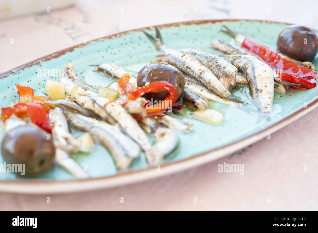 Anchovies marinated in olive oil with olives Stock Photo Alamy