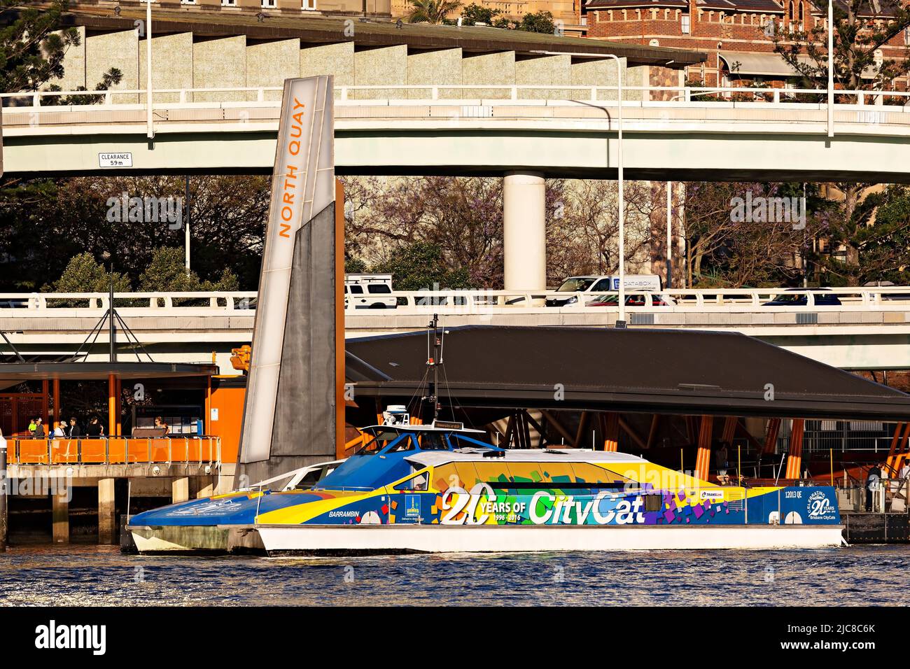 Brisbane Australia /  A fast CityCat Ferry departs from Norrth Quay Ferry Wharf on the Brisbane River. Stock Photo