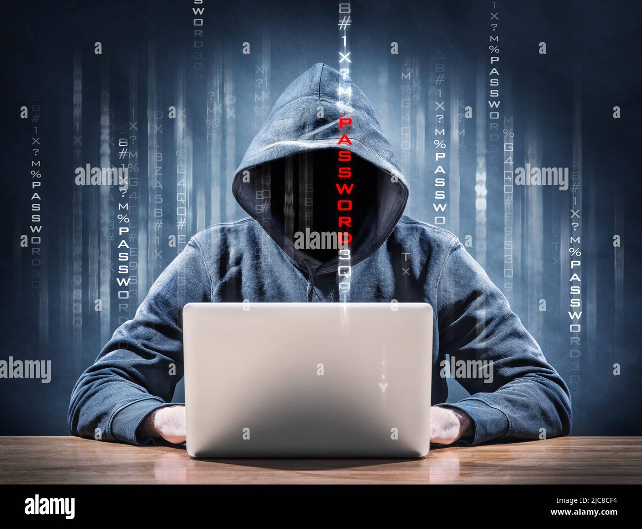 hacker on a laptop tries to steal a password Stock Photo