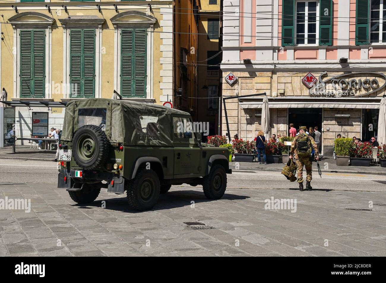 Reconnaissance car Land Rover Defender of the Italian army parked in Piazza De Ferrari, one of the main square of Genoa, Liguria, Italy Stock Photo