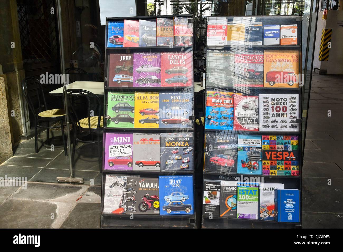 Exterior of a newsstand with Italian vintage cars magazines displayed on the sidewalk, Genoa, Liguria, Italy Stock Photo
