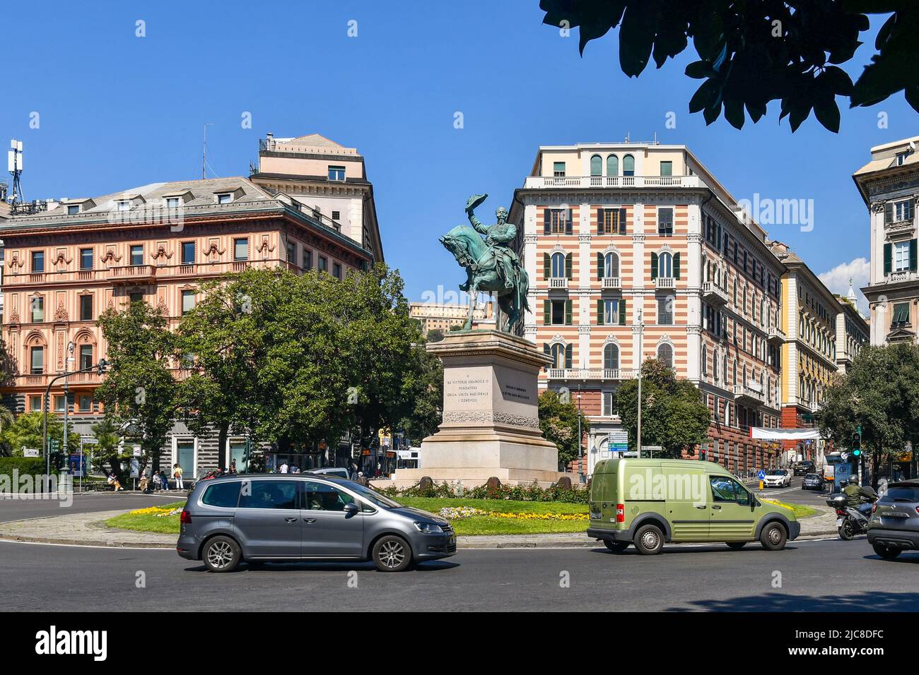 View of Piazza Corvetto square with the bronze statue of Victor Emmanuel of Savoy in the centre of the roundabout, Genoa, Liguria, Italy Stock Photo