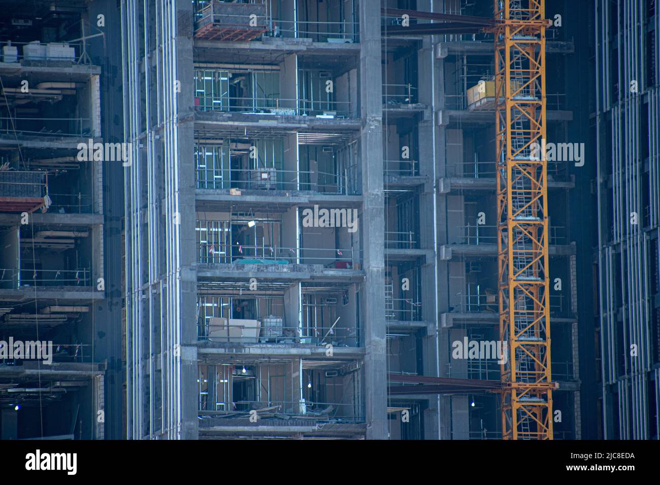 Construction in Kuwait City with the side of a skyscraper exposed Stock Photo