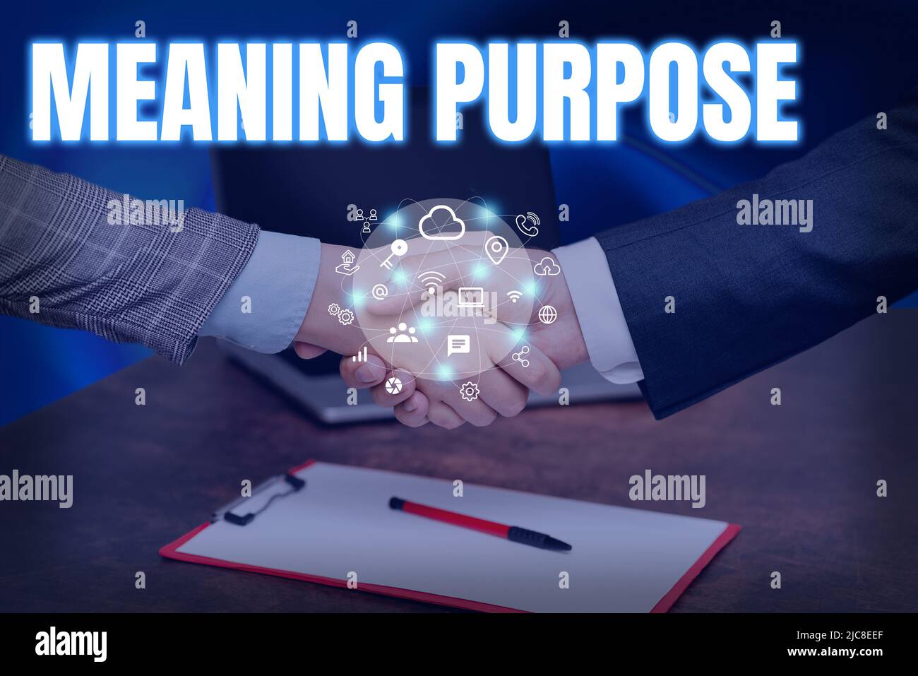 Conceptual caption Meaning Purpose. Business showcase The reason for which something is done or created and exists Hands Shaking Signing Contract Stock Photo