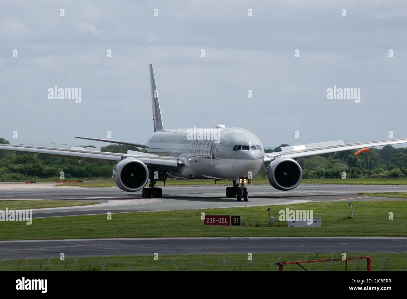Qatar Airlines Boeing 777- 300 er on runway at Manchester Airport UK Stock Photo