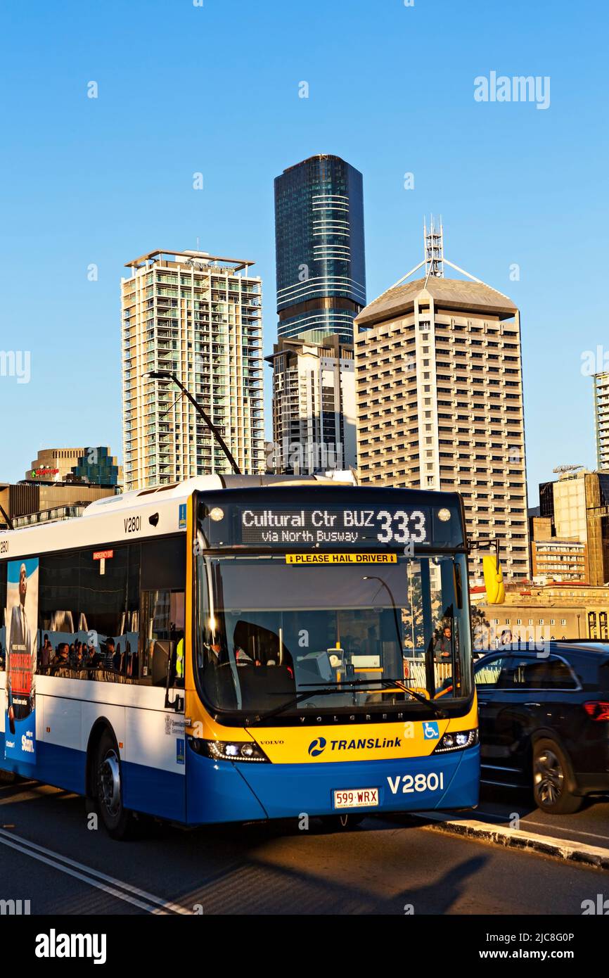 Brisbane Australia /   A Brisbane Translink Bus crosses the Victoria Bridge. The modern Brisbane Skyline rises behind. Stock Photo