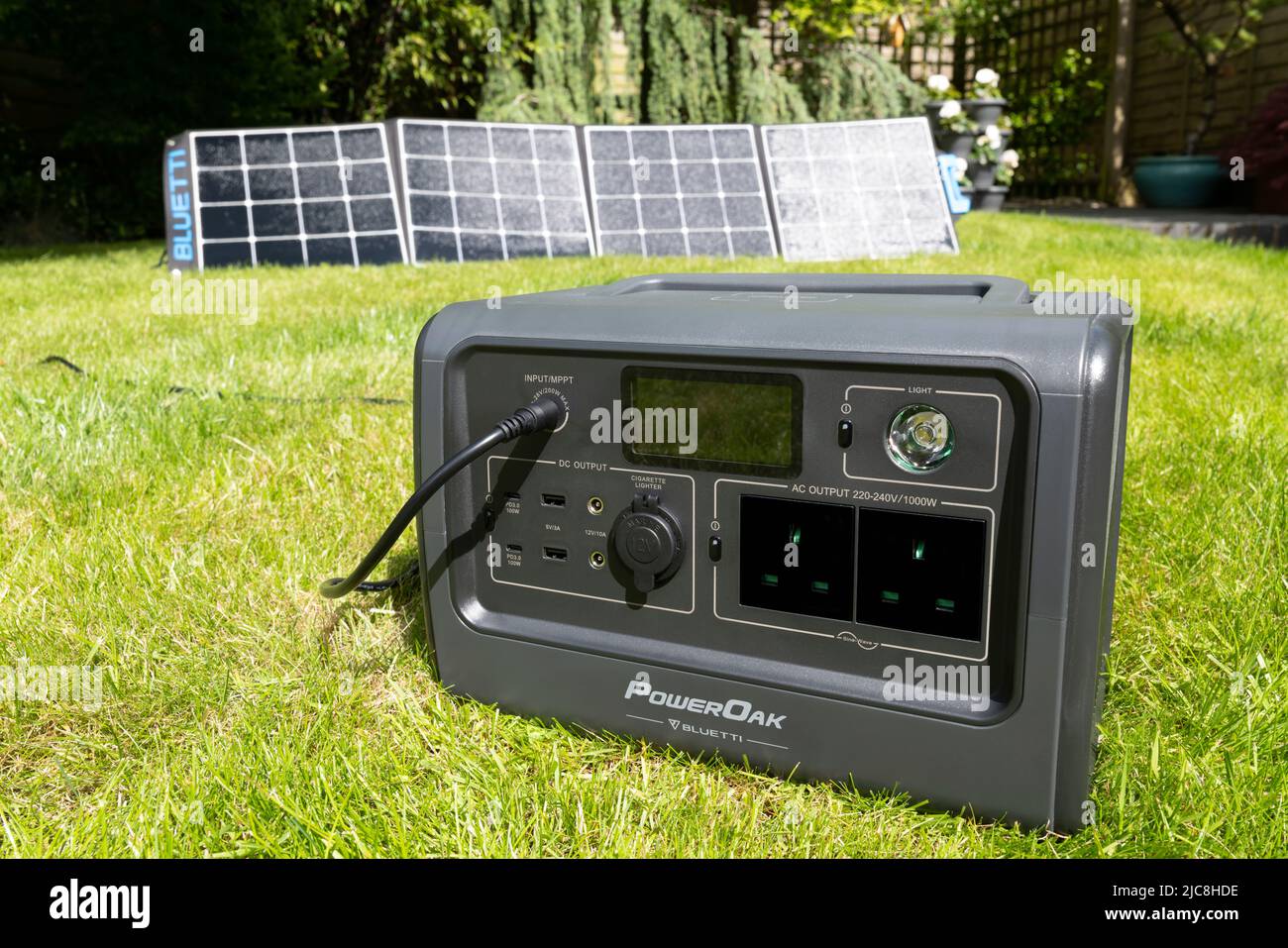 Solar powered battery power station converting the sun's energy into electric power. Stock Photo
