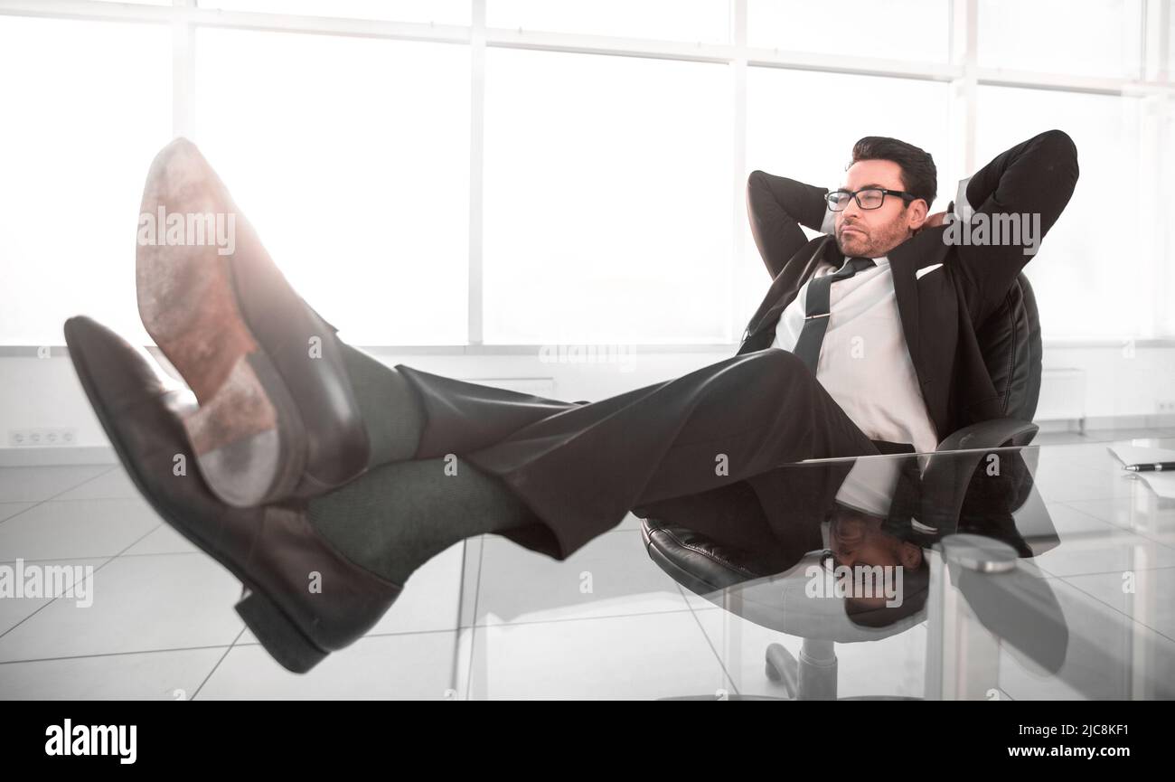 successful businessman dreams of sitting at his Desk Stock Photo Alamy
