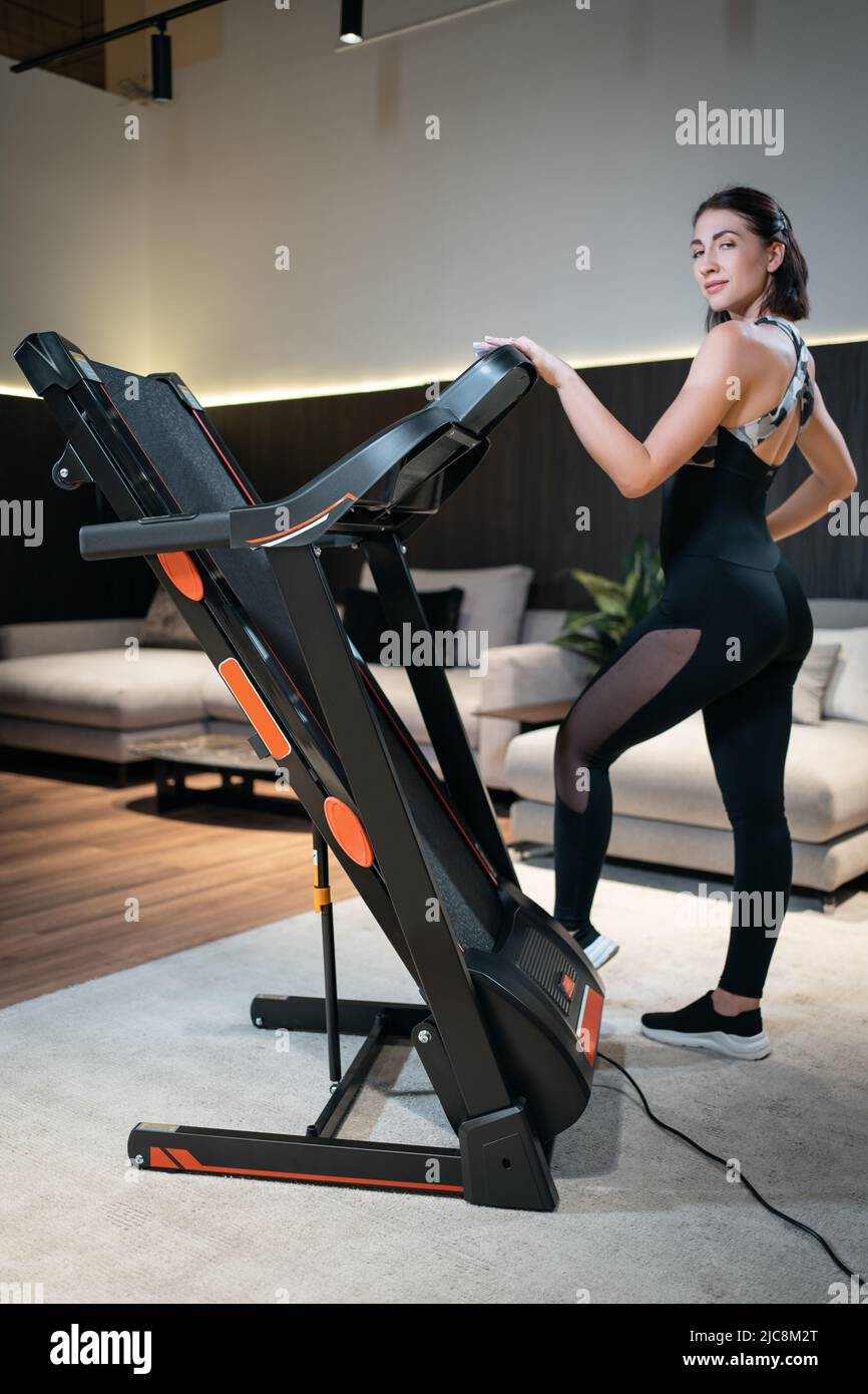 female athlete prepare for training with treadmill Stock Photo