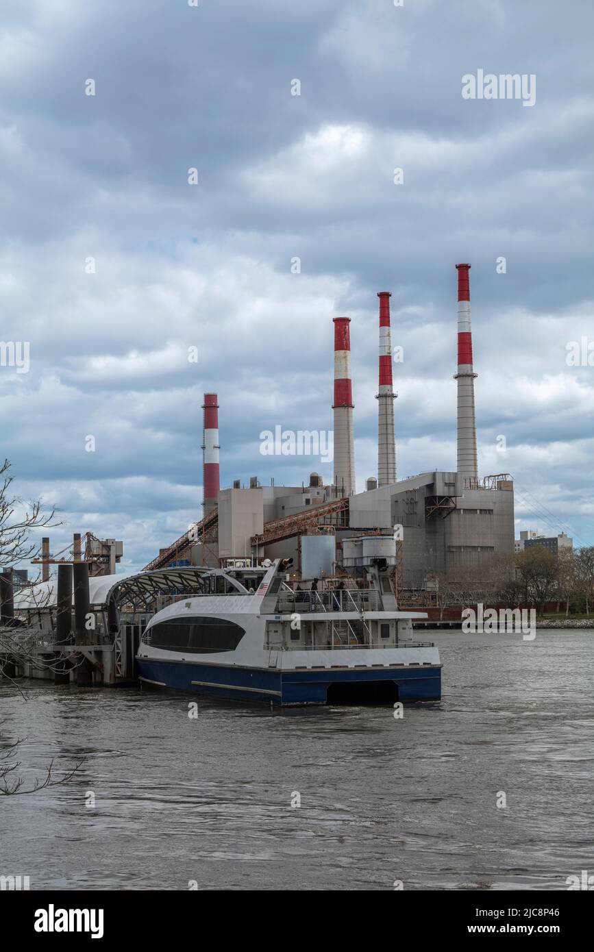 View of Ravenswood Power Station from the East River on a cloudy day Stock Photo