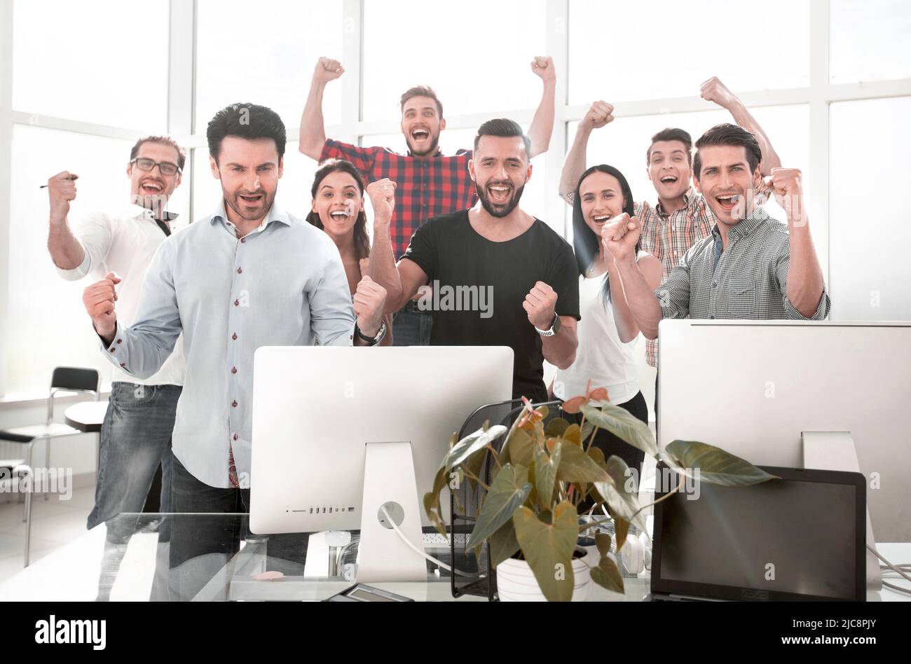 happy business team standing in modern office Stock Photo - Alamy