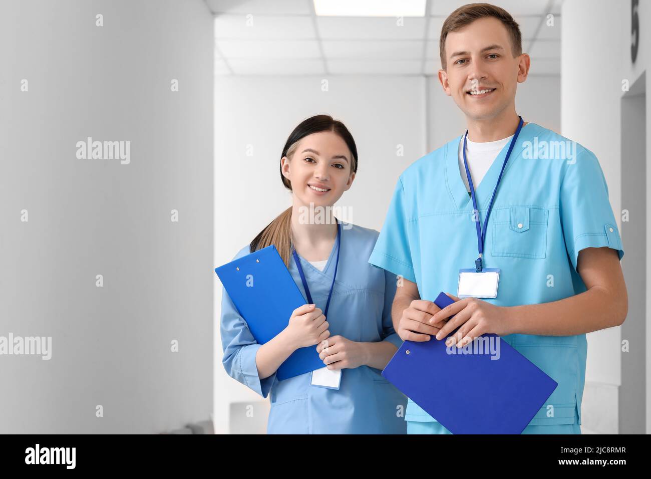 Medical assistants with clipboards in clinic Stock Photo Alamy