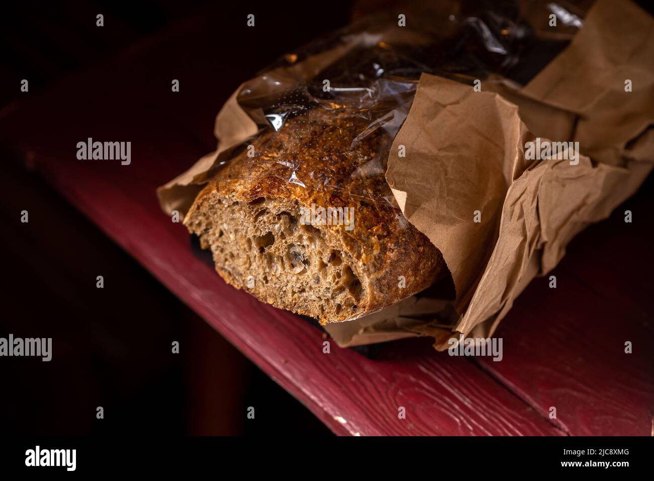 Buckwheat baguette. Sliced baguette made from dark coarse flour. Dark background Stock Photo Alamy