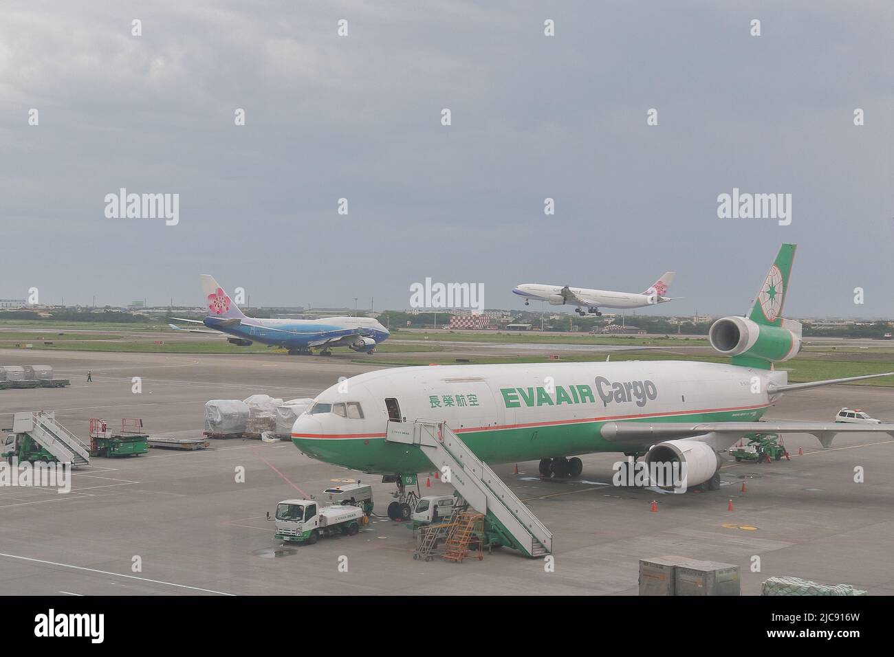 Eva Air Cargo McDonnell Douglas MD-11F B-16109 and other airplanes at the Taoyuan International Airport (TPE), Taiwan Stock Photo