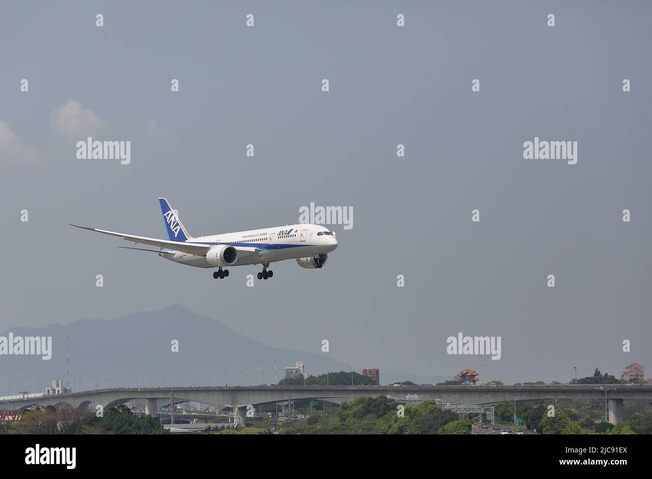 JA831A All Nippon Airways Boeing 787-8 Dreamliner (ANA NH851) from Tokyo (Haneda) (HND) is about to land to Taipei Songshan Airport (TSA). Stock Photo