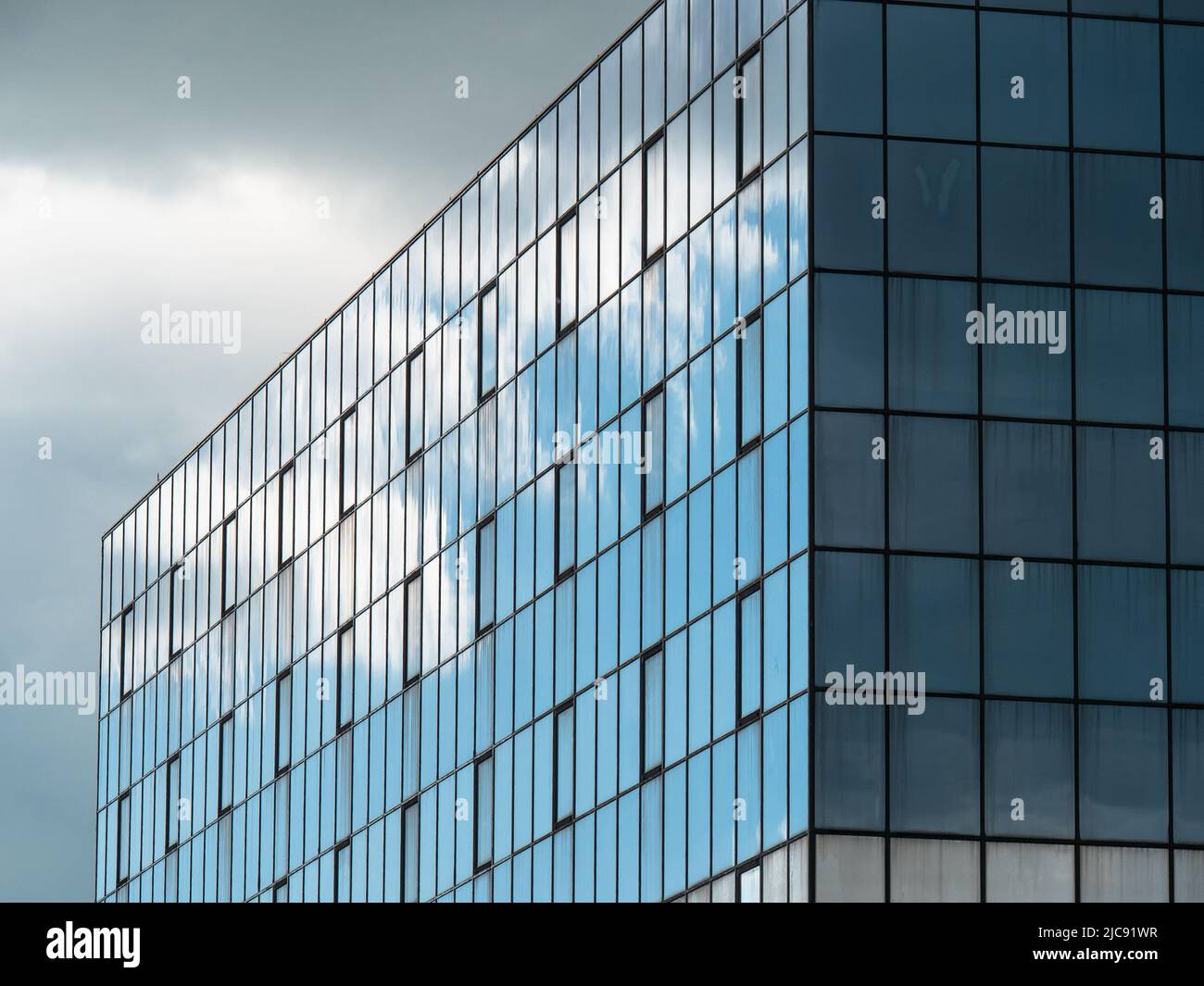 Blue Sky and Clouds Reflected in the Glass Building Stock Photo - Alamy