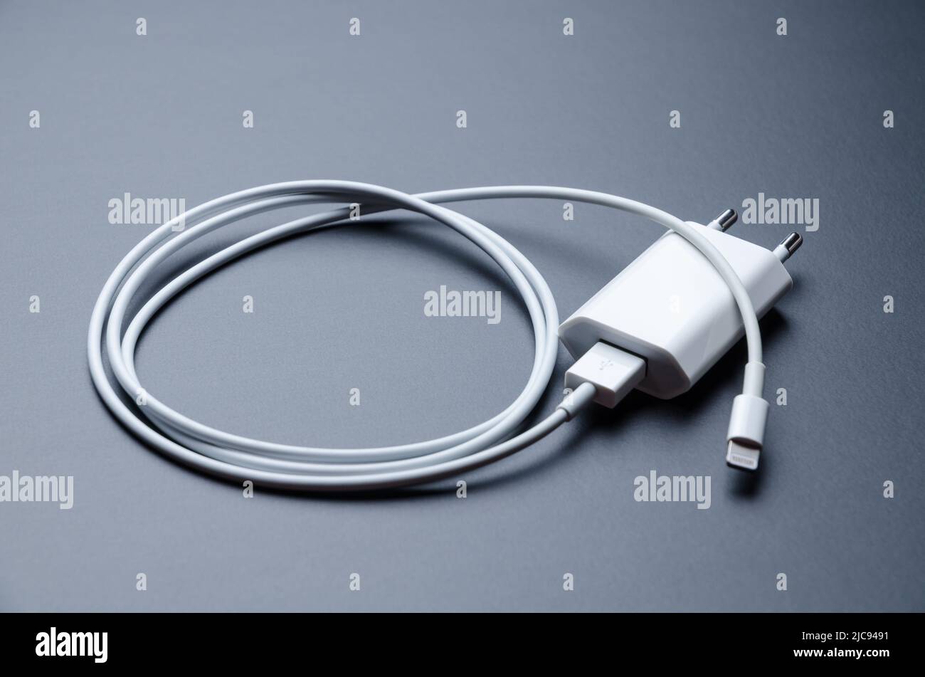 Apple iPhone lightning charger and USB cable for charging Stock Photo