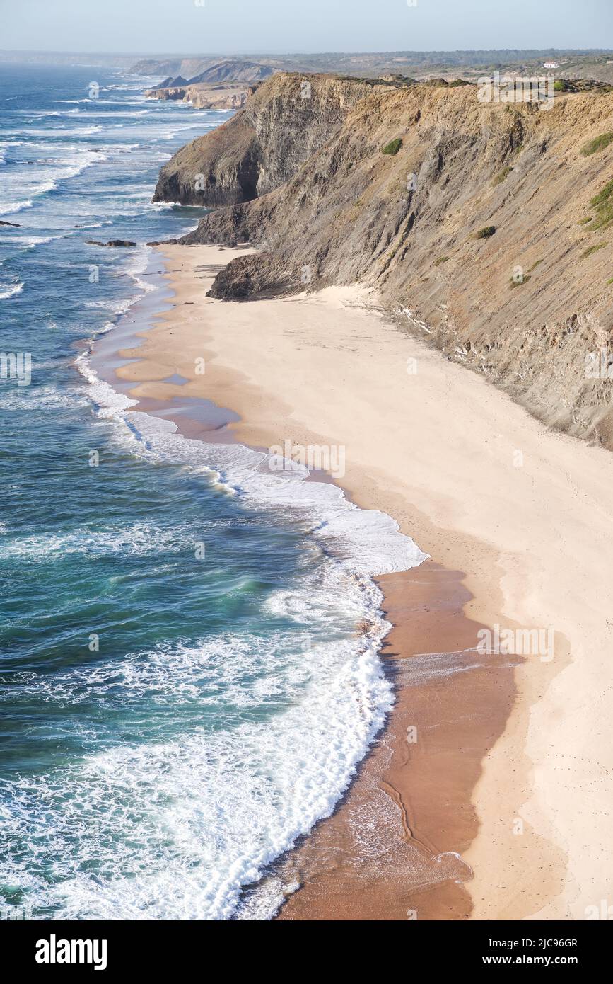 Different shades of sand create a striking contrast in the receding tide - Praia de Fateixa, Algarve, Portugal Stock Photo