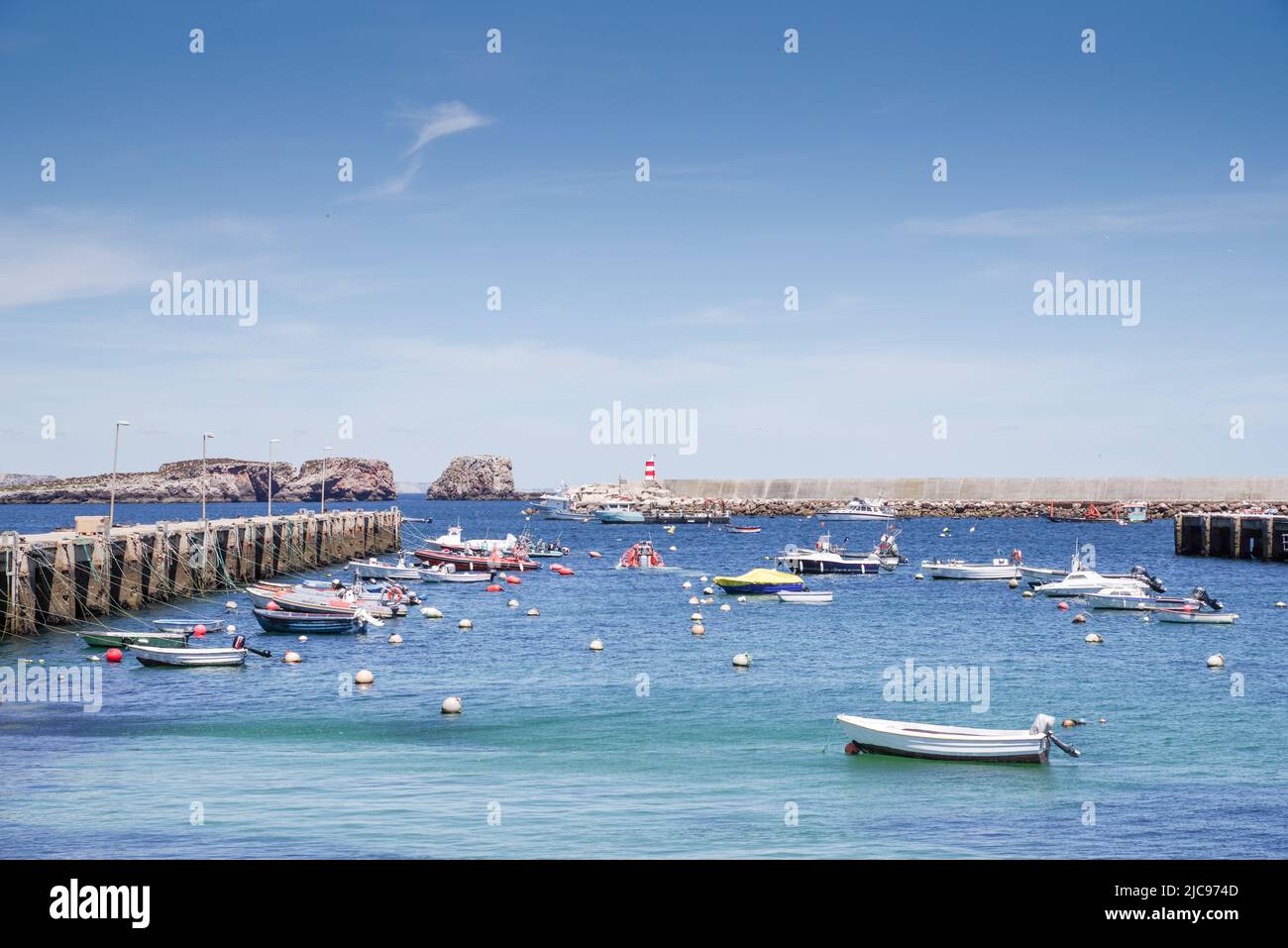 Entrance to Sagres Harbour is sheltered by Martinhal Islets (in the background) - Sagres, Algarve, Portugal Stock Photo