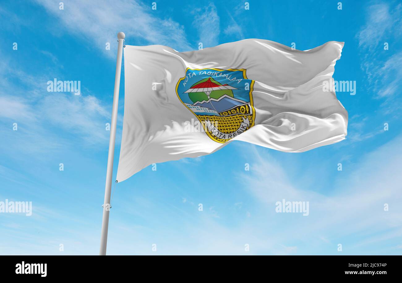official flag of City Tasikmalaya Indonesia at cloudy sky background on sunset, panoramic view. Indonesian travel and patriot concept. copy space for Stock Photo