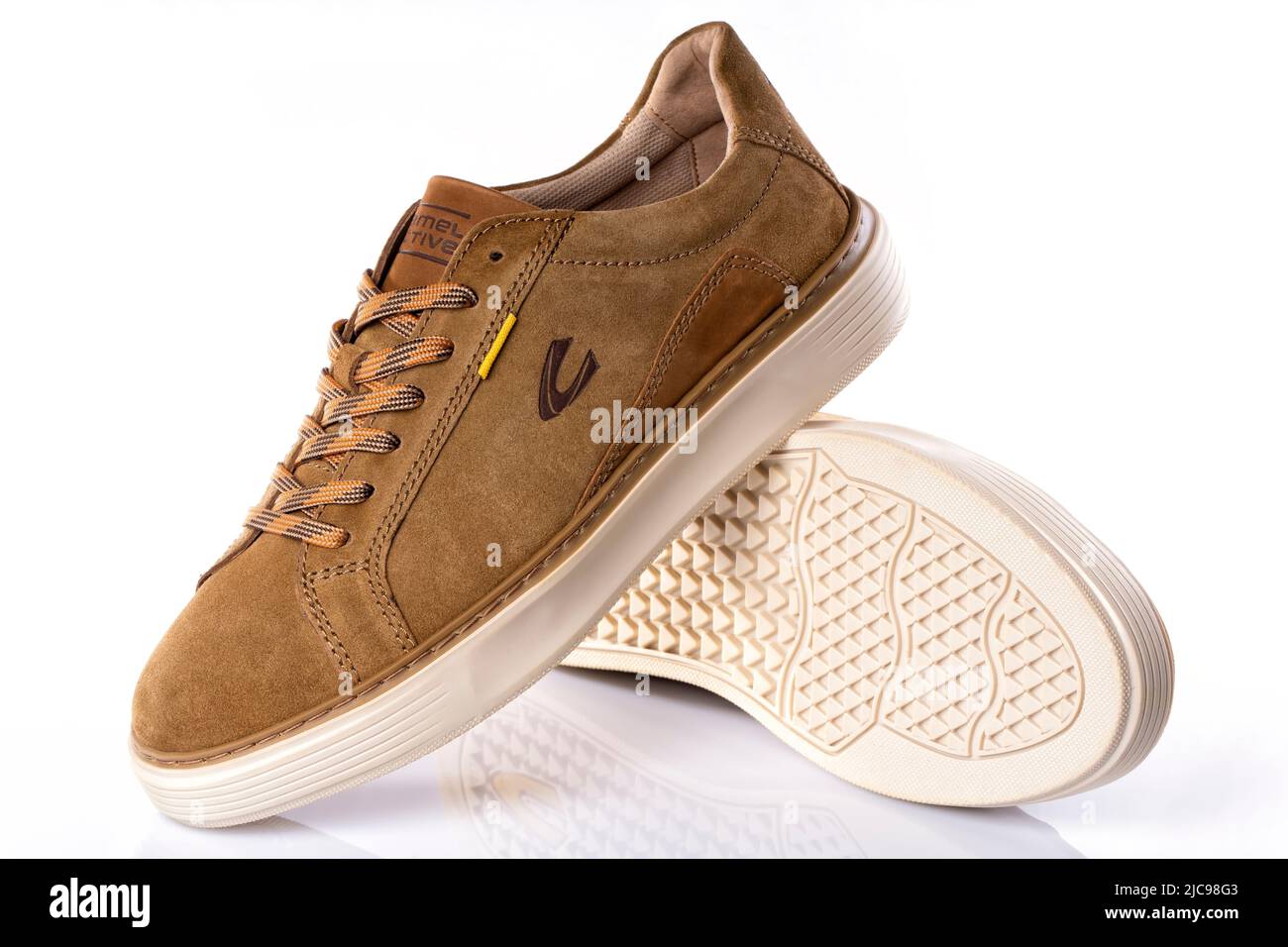 Detail the new Camel Active Avon Sneaker for men in cognac color isolated on white. taken on June 10, 2022 in Spain Stock Photo - Alamy
