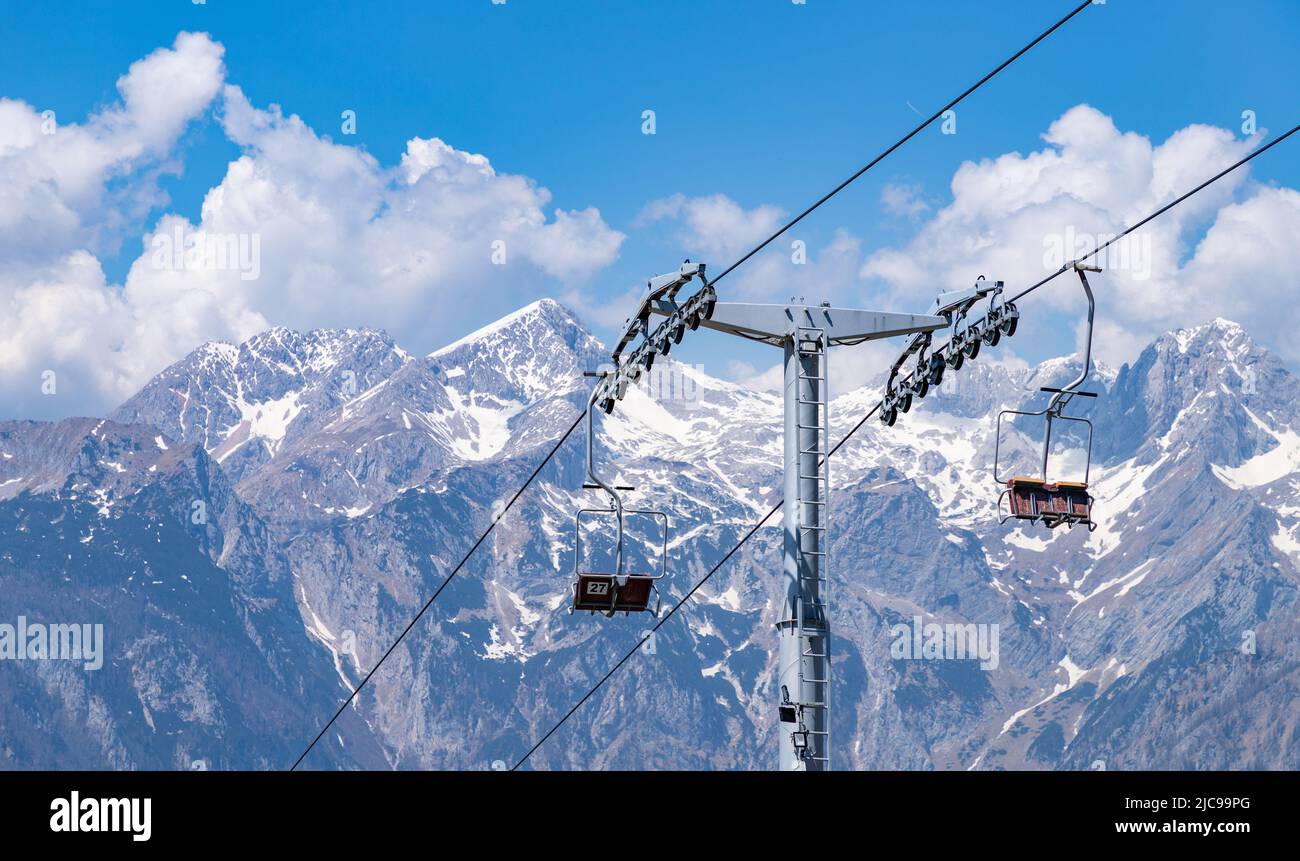 A picture of the Kamnik–Savinja Alps on the background of the Velika Planina's ski lifts. Stock Photo