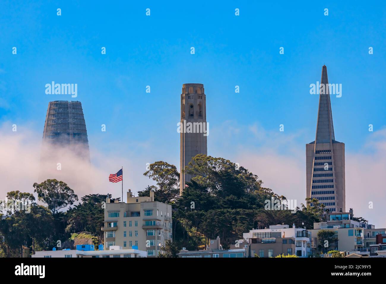San Francisco city skyline with Karl the Fog rolling through the landmark towers Stock Photo