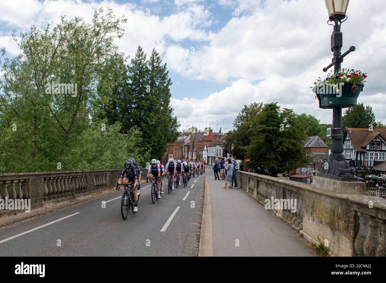 Wallingford, UK. 11th June 2022, The Women's Tour, UK's first international stage cycling race for women, cycles across Wallingford Bridge. Credit Lu Parrott/Alamy Live News Stock Photo