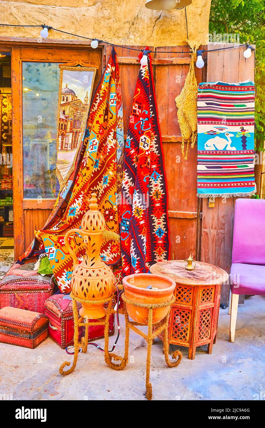 The colorful rugs, vintage clay cookware and handmade wooden furniture