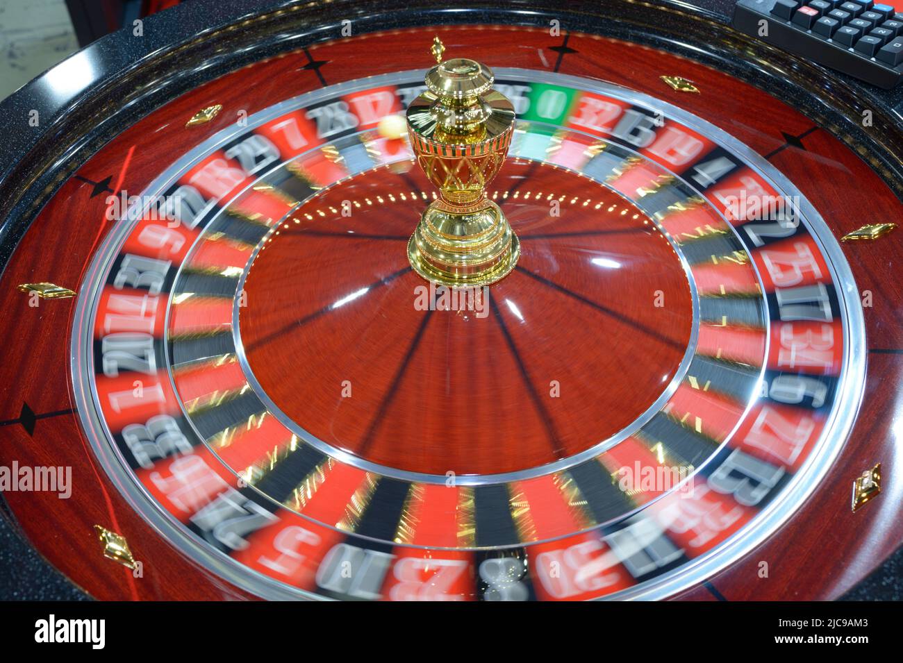 American roulette table, gambling. Roulette wheel spinning clockwise