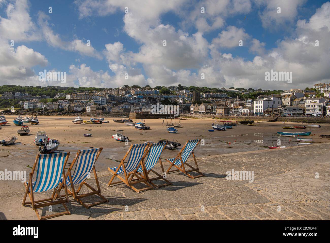 St Ives, UK. 11th June, 2022. A train runs on the picturesque St Ives Bay Railway Line passing through Lelant Beach in the background, en route to St Ives Credit: kathleen white/Alamy Live News Stock Photo