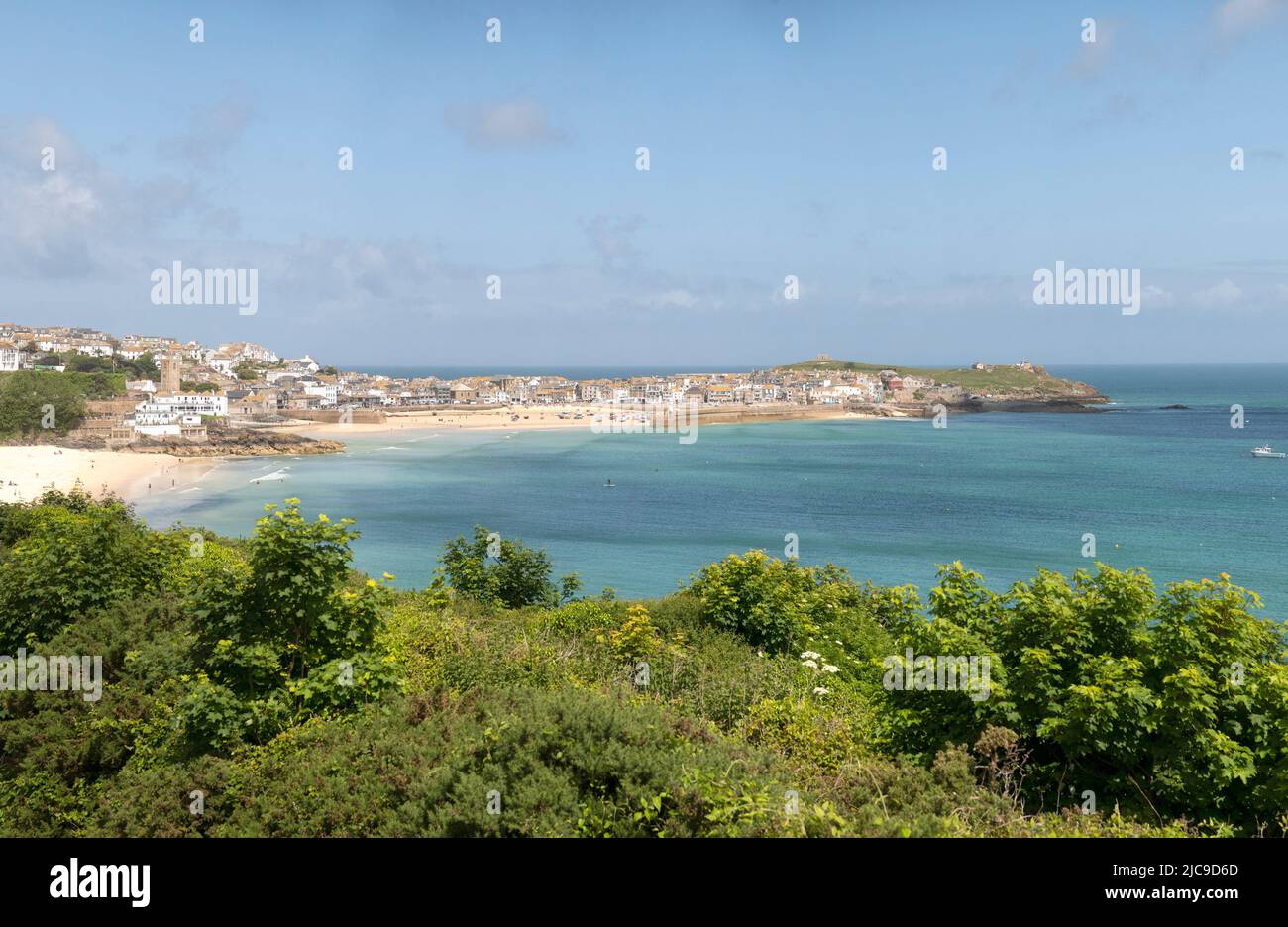 St Ives, UK. 11th June, 2022. A train runs on the picturesque St Ives Bay Railway Line passing through Lelant Beach in the background, en route to St Ives Credit: kathleen white/Alamy Live News Stock Photo