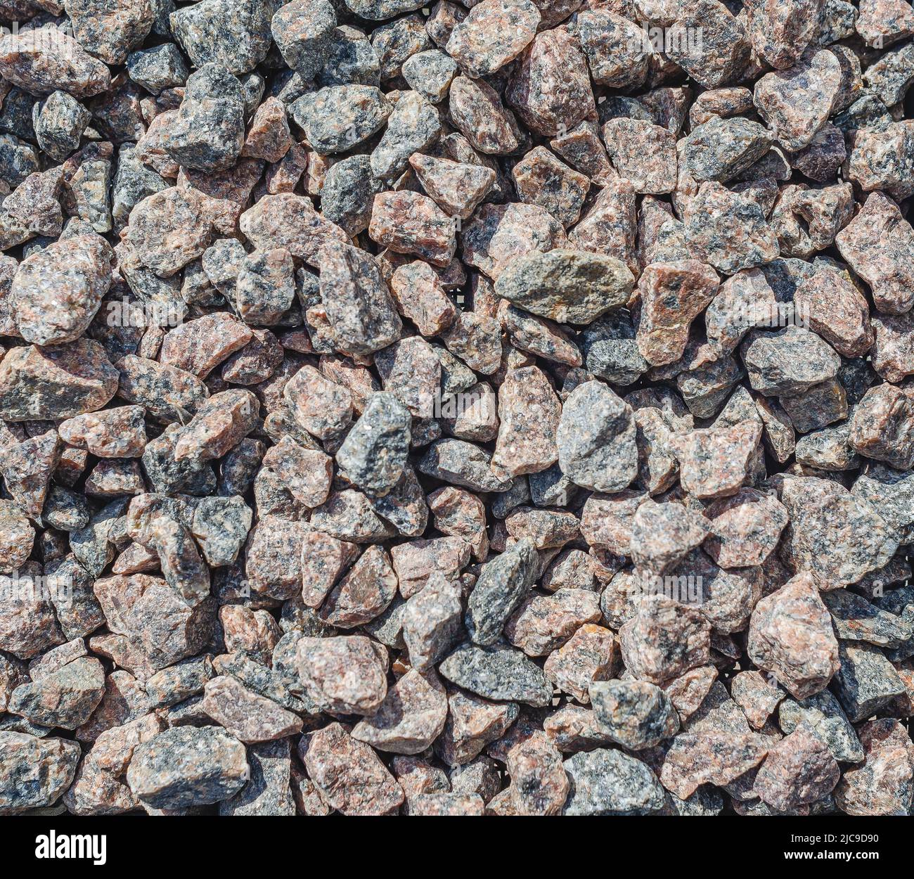 Decorative stones. Many small stones of rough structure, gray black