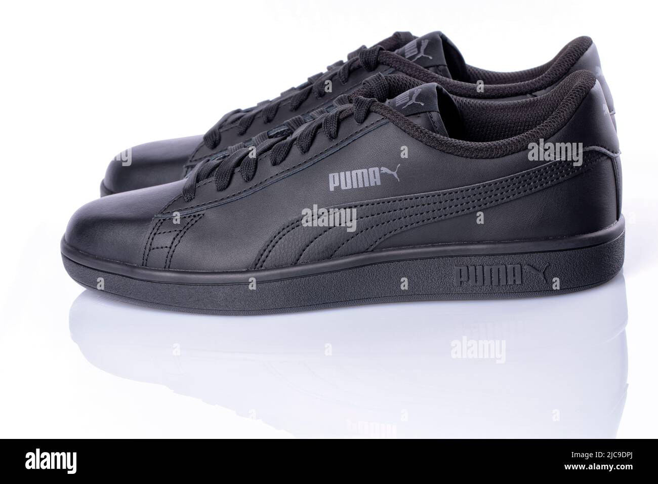 Detail of the new Puma Smash v2 sneakers in black color isolated on white. Photograph taken on June 10, 2022 in Spain. Stock Photo