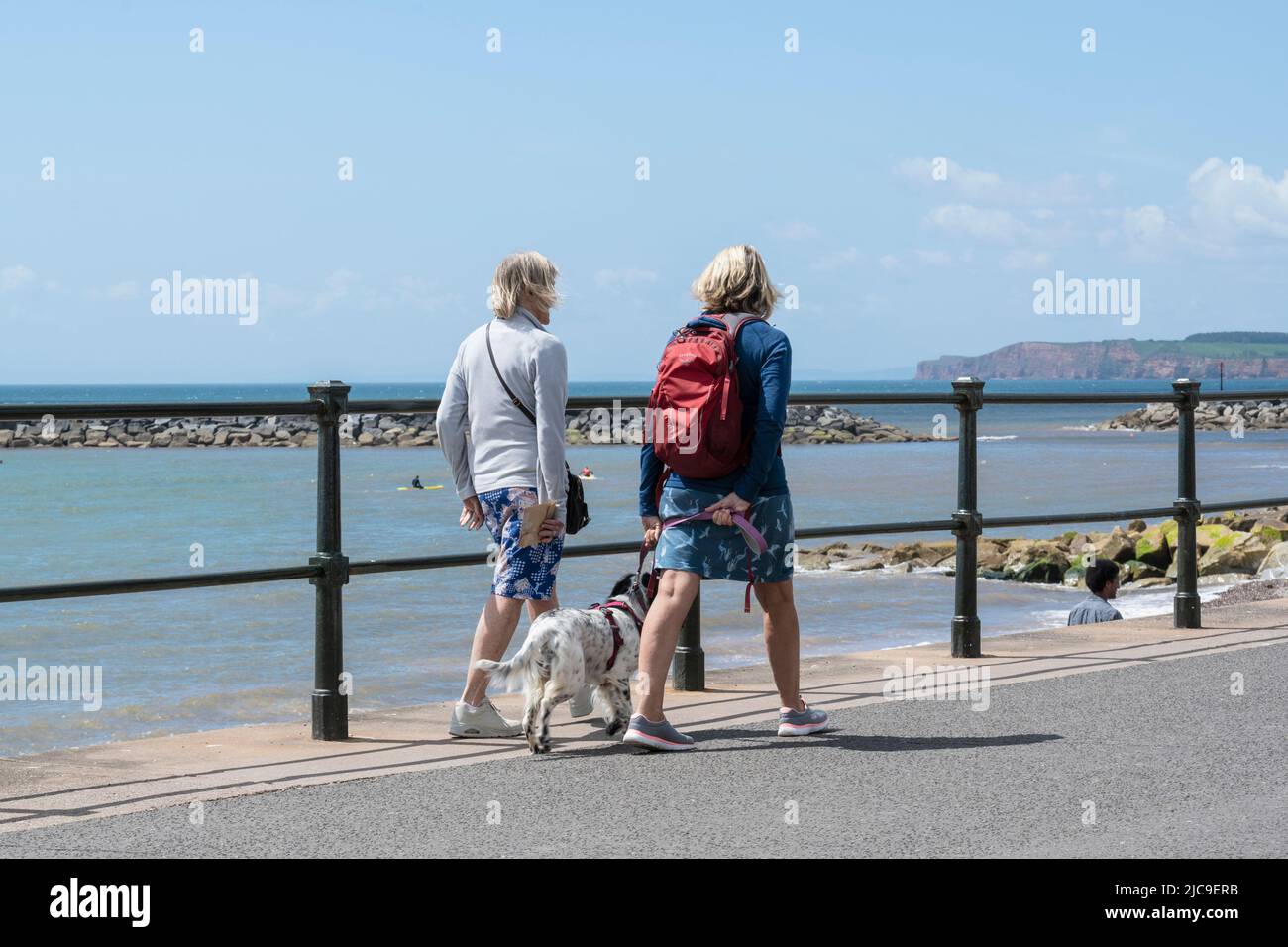 Sidmouth, East Devon, UK. 11th June, 2022. UK Weather: Warm sunny spells and a brisk breeze at the seaside town of Sidmouth this afternoon. Holidaymakers and locals visited the pretty regency town to enjoy a stroll along the esplanade. Credit: Celia McMahon/Alamy Live News Stock Photo