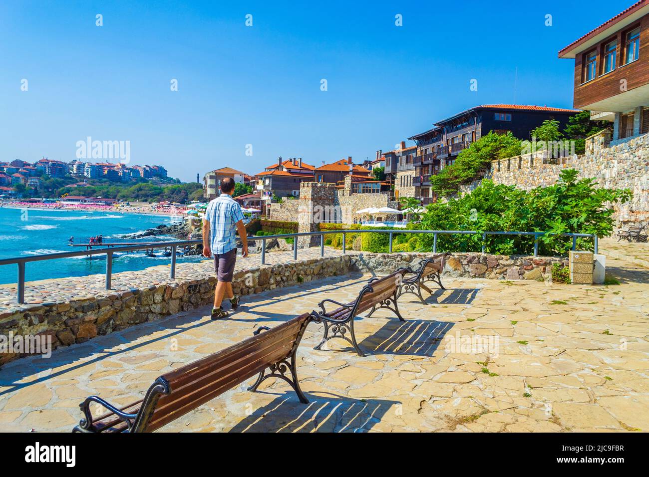 Traditional Wooden Houses And Ancient Fortification Stone Wall Black traditional-wooden-houses-and-ancient-fortification-stone-wall-black