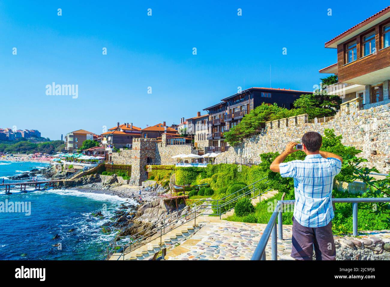 Traditional Wooden Houses And Ancient Fortification Stone Wall Black traditional-wooden-houses-and-ancient-fortification-stone-wall-black